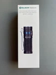 Olight Baton 4 Flashlight, Black With Blue In Factory Sealed Box. Fixed Price $40.00.